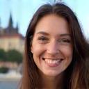 Sophie K. smiling with Prague castle in background